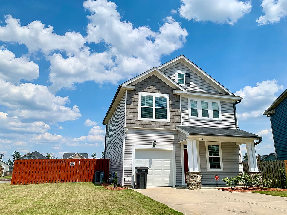 Spacious fenced backyard with open green space behind _ great for kids!