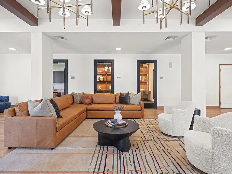 Lounge area with access to private conference rooms and coworking spaces.