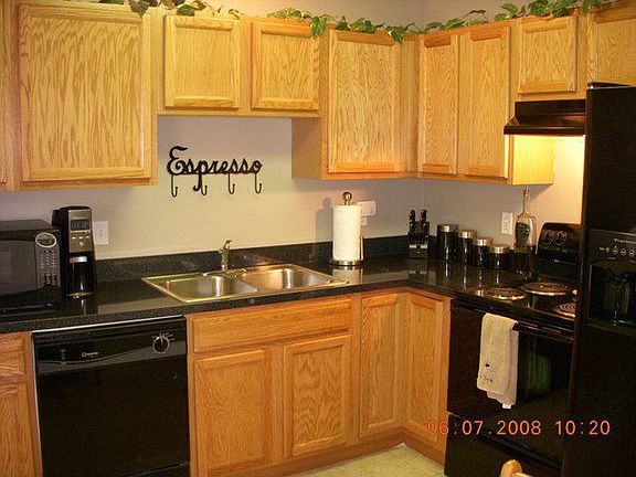 Amazing kitchen has oak cabinets and upgraded appliances that all stay!