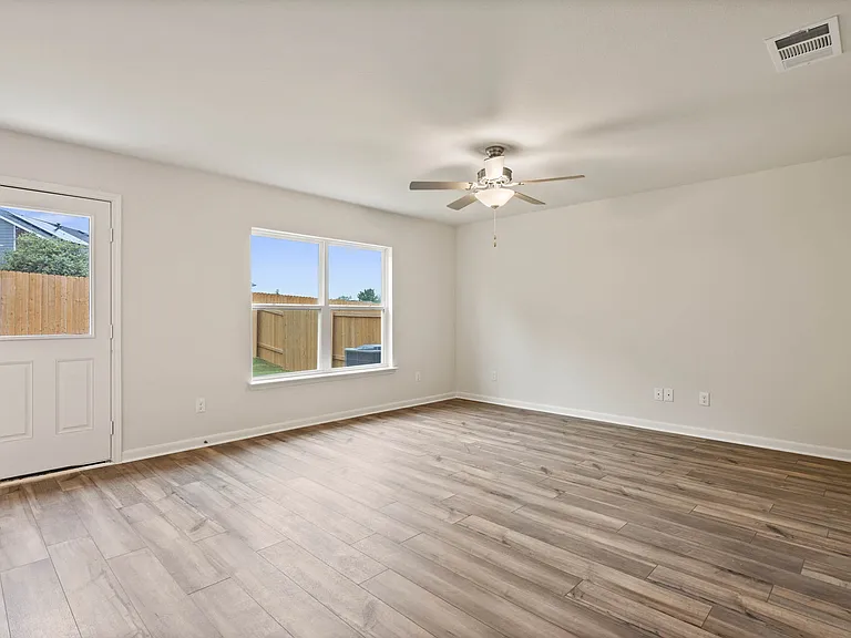 The family room has a large window that lets in great, natural light.