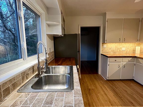 kitchen tile counter fridge view to entry of dining room