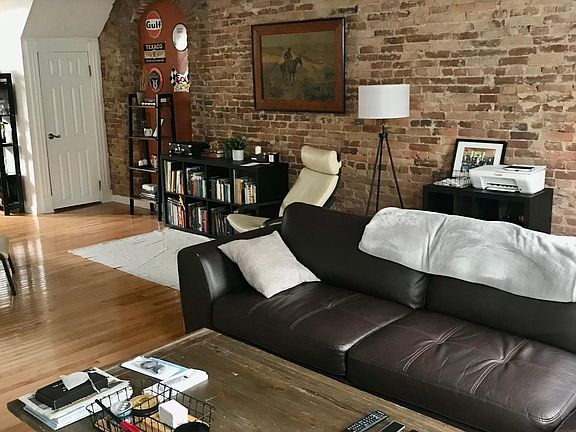 Exposed Brick, High Ceilings, Lots of Natural Light, Window Blinds Included.
