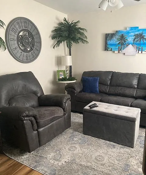 example of living room with furniture; apartment is unfurnished