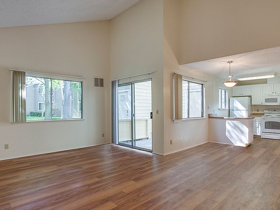 Spacious bedrooms with wood plank flooring