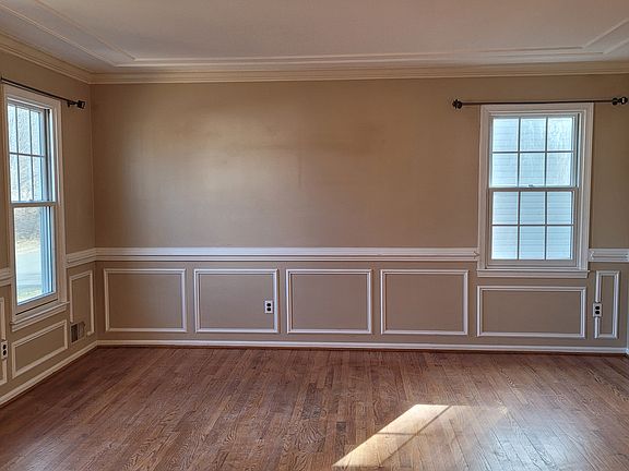LR with detailed millwork (chair rails, picture boxes, crown mouldings)