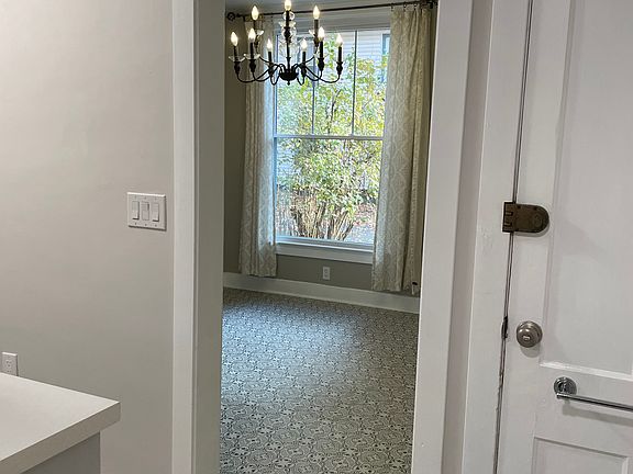 Second door leads to interior staircase and basement