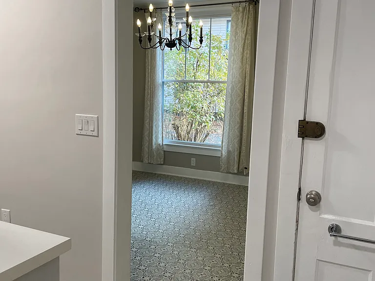 Second door leads to interior staircase and basement