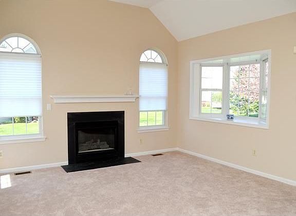 Gas fireplace, bay window, & lots of natural light