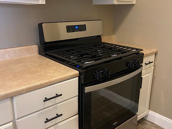 BRAND NEW RANGE AND REFRIGERATOR INCLUDED