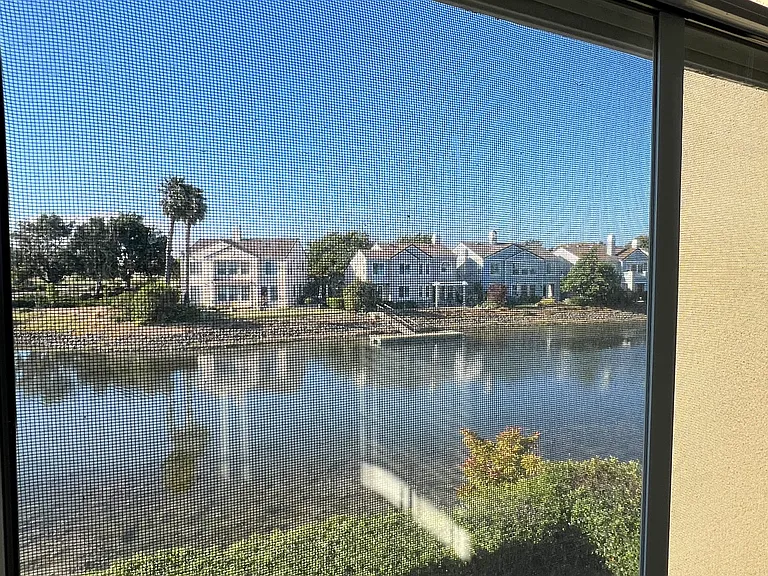 Waterfront view and partial backyard view from Master Bedroom