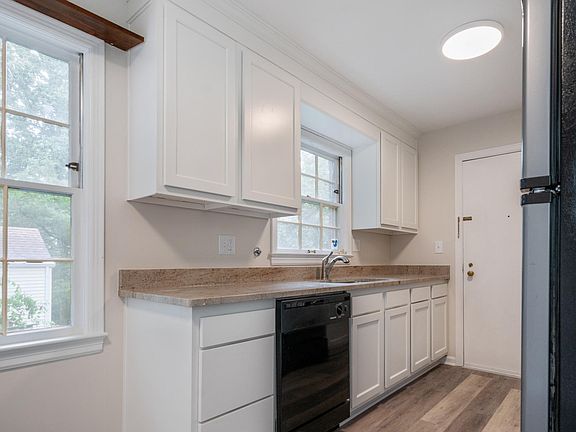 New Kitchen Cabinets with New Granite and sink.
