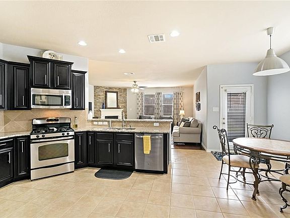 Kitchen features stainless appliances, granite and gas cooktop. Note the hardware on the cabinets gives it that special touch!