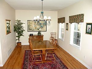 Formal dining room with gleaming hardwood floors