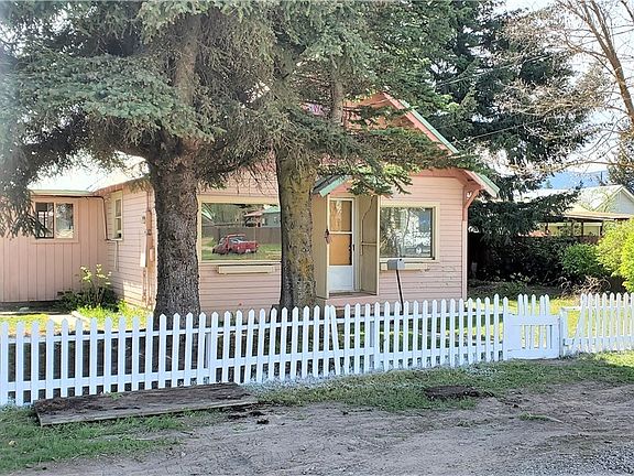 Parking both in front of the house on the street available or options on the back side of the lot with both a detached carport and a detached garage.