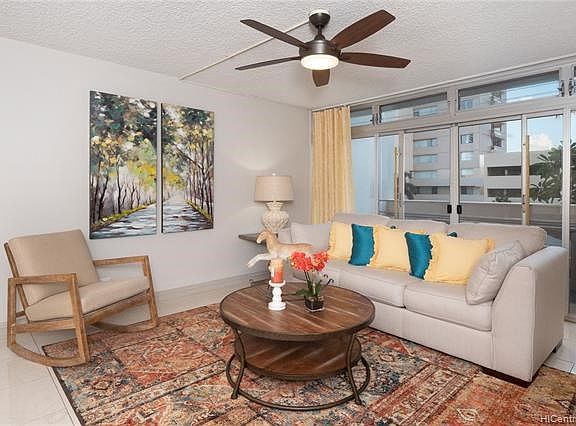 Entire apt just repainted in soft decorator colors which can be easy to blend with any style.  Large lanai partially protected through the glass doors.  This unit faces University Avenue on the Ala Wai canal end.