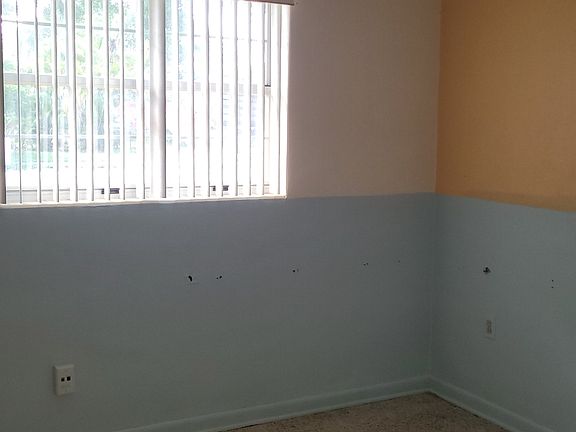 First Bedroom has a bookcase wall, gray and yellow...could be used as an office..