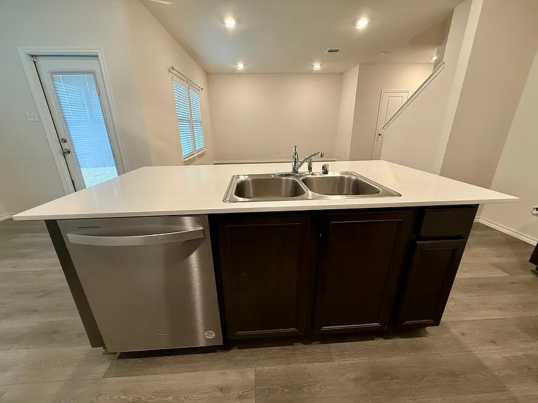 Kitchen, center island, sink, and dishwasher