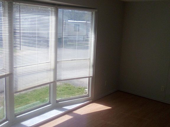 another side of the front room with wood flooring