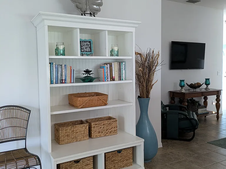 Open storage in living room -to the right of the pocket door to Master Bedroom