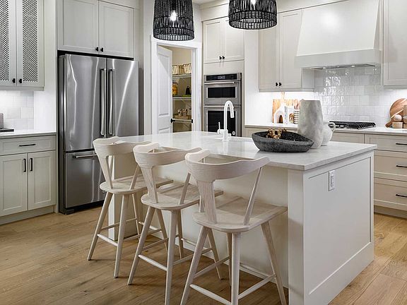 A photo of the kitchen in the Purcell 26 show home in Calgary by Brookfield Residential