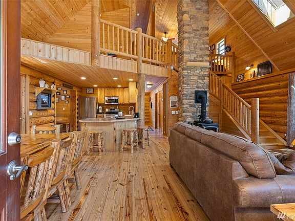 Welcome home! This main floor is STUNNING! Beautiful wood floors, 2 story fireplace, open great room with VIEWS.