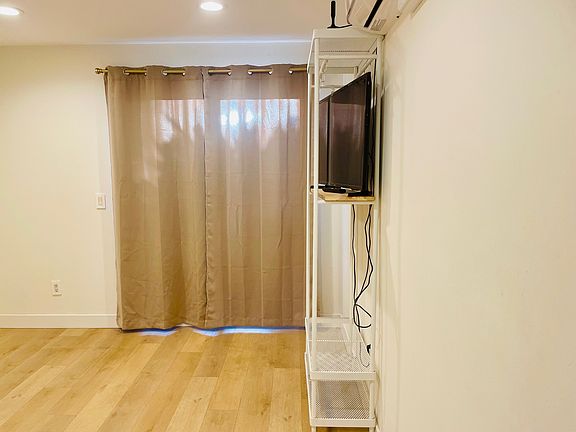 Bedroom facing private backyard
