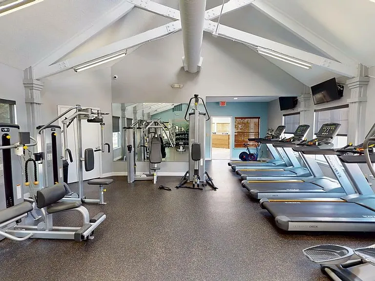 Fully Equipped Fitness Center with Machines and Weights