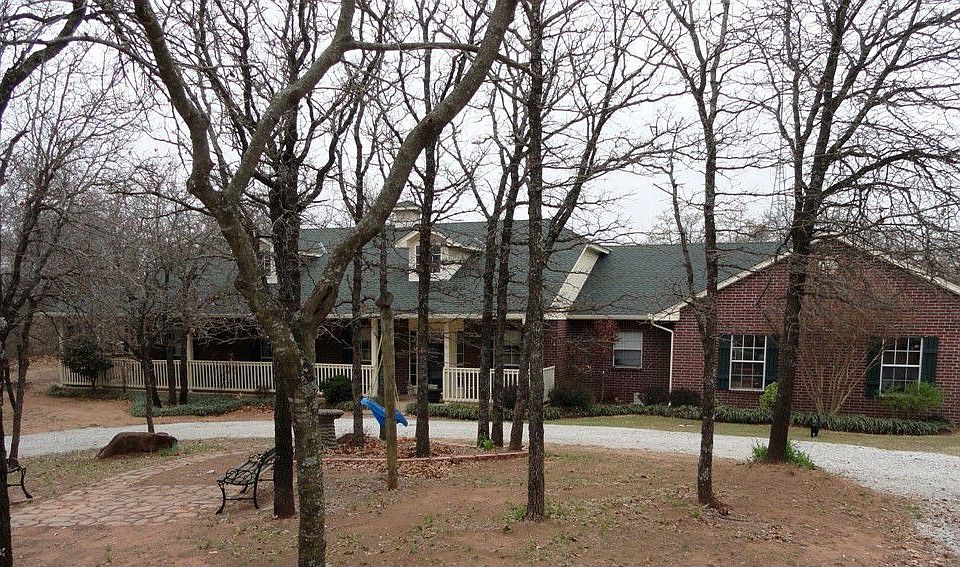 Notice the covered wraparound porch!!!