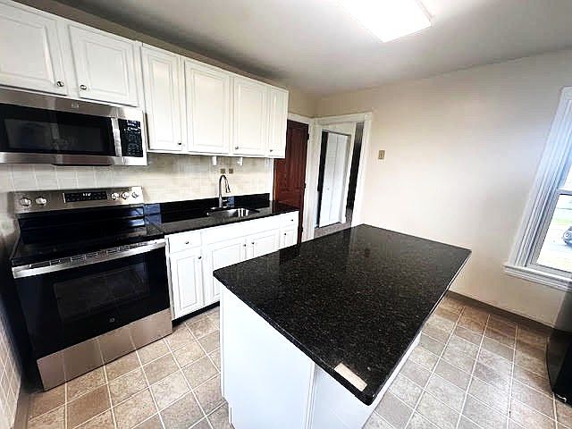New stove, microwave, sink and faucet