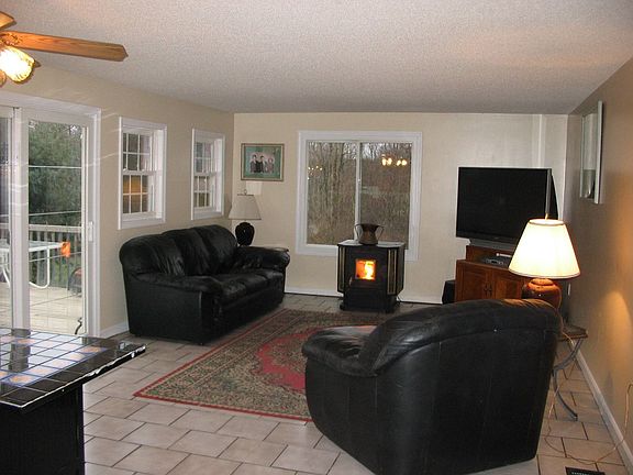 Family room w/pellet stove and slider to deck.
