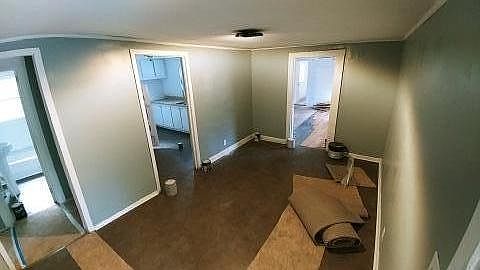 freshly painted walls, trim, new lighting, and new flooring NOW make this dining room area look great