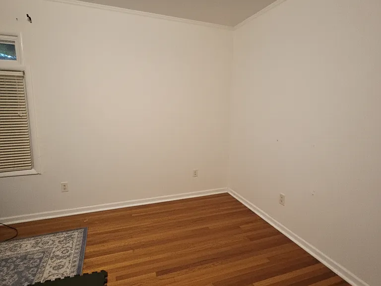 The front bedroom with half bath.
