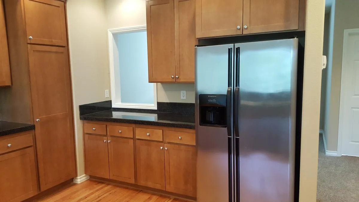 Kitchen pass through to dining room, refrigerator/freezer - 10478 NW Forest View Way