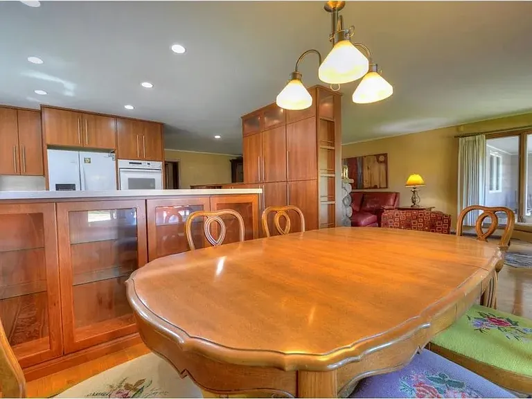 Dining area next to kitchen and living room