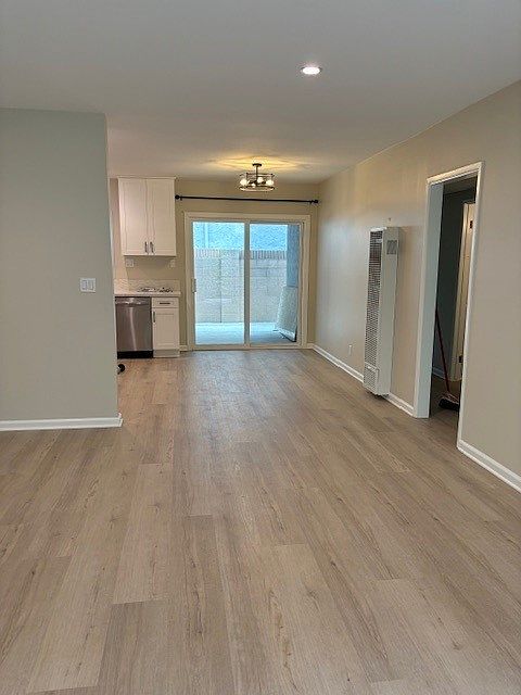 Living room view of dining area and outside private patio area.