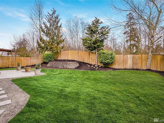 Remastered landscaping, fully fenced backyard and adjacent to a private greenbelt.  $5500 in landscaping enhancement.