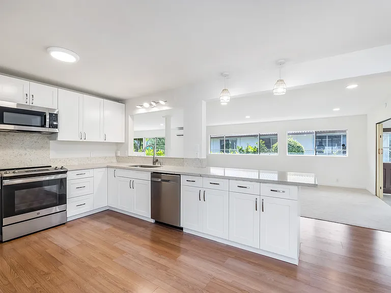 Kitchen into dining and little bit of laundry room.