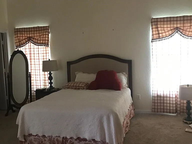 Huge primary bedroom with two oversized closets.