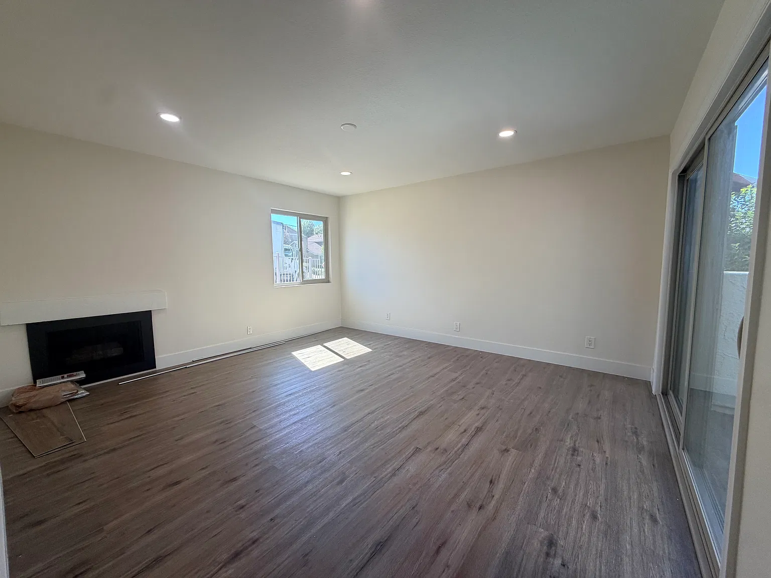 Unit A Living Room with Sliding Glass Door to Front Patio Area