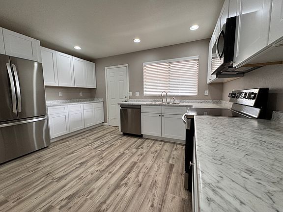 Kitchen with new cabinets & countertops. All new appliances.