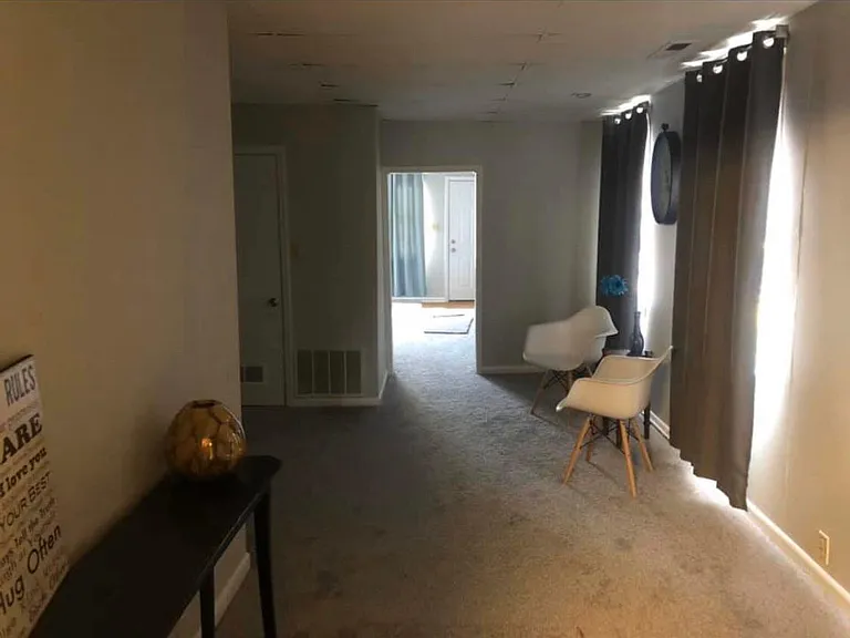 Extra living area between living room & kitchen. How would you use this area? Office, game room or something else. This room ha a walkin closet for your stuff.