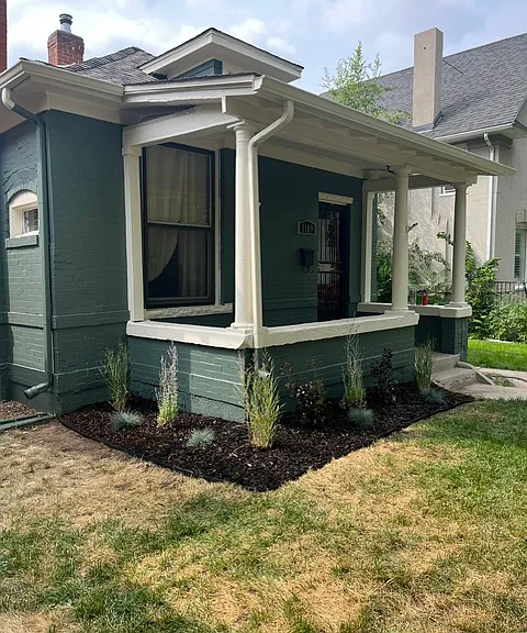 A perfect front porch for people watching or having a lazy Saturday morning coffee.