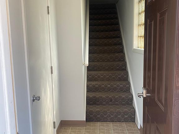 Interior entrance. Door access to washer & dryer on left.