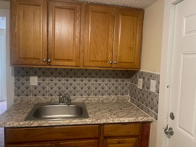 Kitchen with tiled back splash
