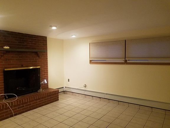 Large Living Room With Exposed Brick