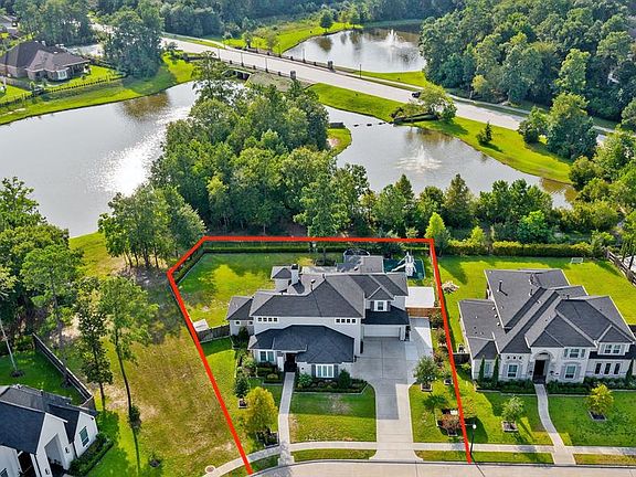 Hard to find, nearly half-acre lot with greenbelt on one side and wooded reserve and lake views behind.