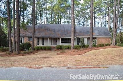 Front of house with a lovely porch fit for rocking chairs.