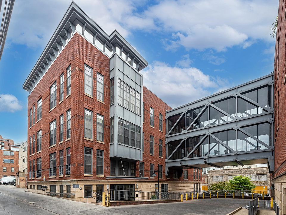 Stunning architectural exterior combining contemporary and traditional features plus glass bridge between buildings!