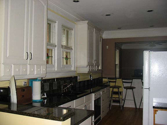 View of Kitchen taken from the breakfast nook. The bar at far end separates the Kitchen from the large Dining Room. Behind the Dining Room would be the Living Room.