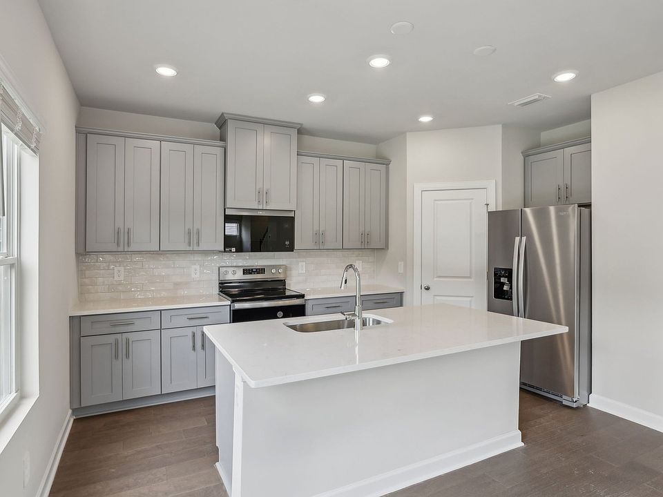 The oversized kitchen island is a perfect bar counter for additional seating.